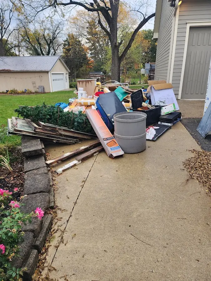 Dumpster being loaded with debris for Residential Dumpster Rental in Okmulgee